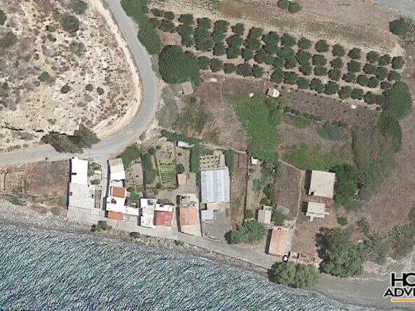 Waterfront plot with 3 unfinished buildings in Faflagkos