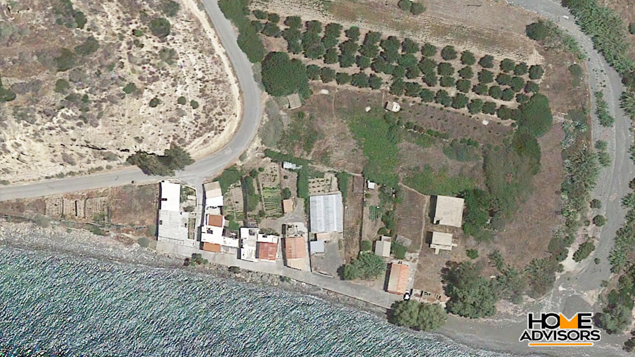 Waterfront plot with 3 unfinished buildings in Faflagkos